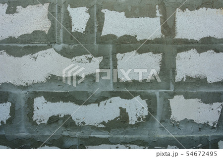 Gray wall of foam blocks on glutinous solution 54672495