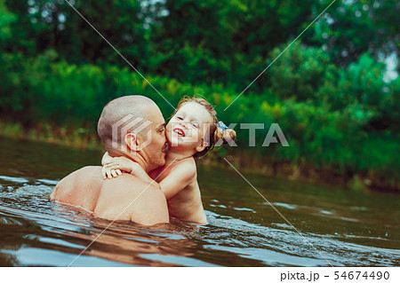 Dad and child bathe in the river Dad and child bathe in the river 54674490