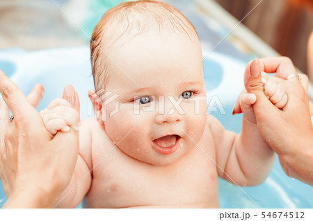 baby boy bathed in the outdoor tub 54674512