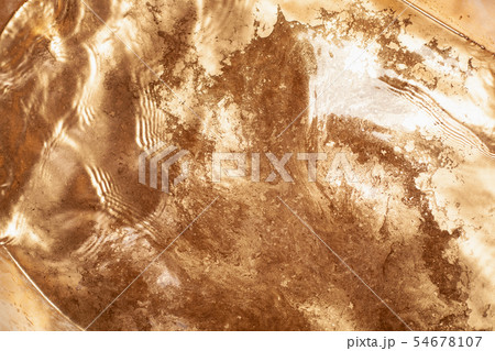 Gold chemical dirty colored water background close 54678107