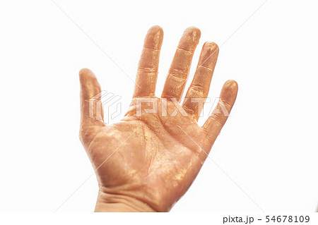 Human hand painted gold paint isolated on white 54678109