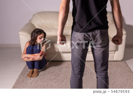 domestic violence, alcoholic and abuse concept - drunk man abusing his wife domestic violence, alcoholic and abuse concept - drunk man abusing his wife 54679593