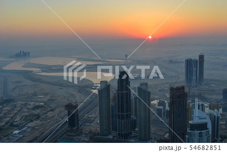 Aerial view of Dubai City at sunrise Aerial view of Dubai City at sunrise 54682851