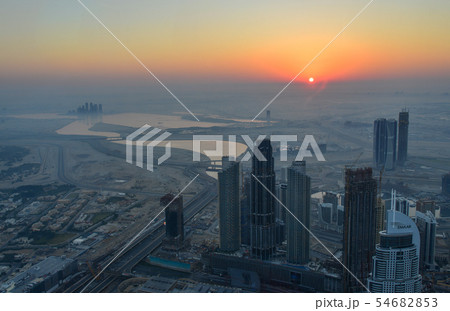 Aerial view of Dubai City at sunrise Aerial view of Dubai City at sunrise 54682853