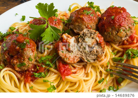 Pasta and meatballs with mozzarella inside Pasta and meatballs with mozzarella inside 54689876