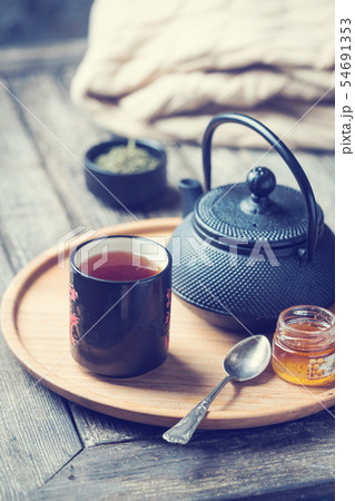 tea cup with tea pot on a tray tea cup with tea pot on a tray 54691353