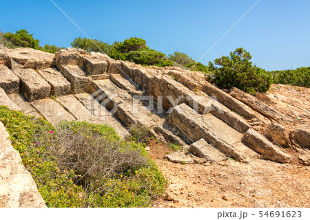 Rocky coast of Punta de n'Amer on Island Mallorca 54691623