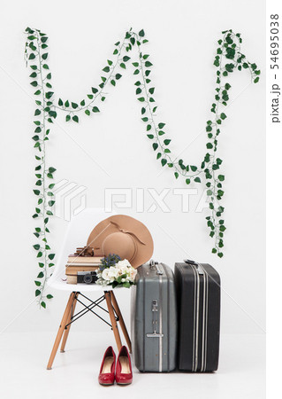 suitcase with shoes, and flower ready for travel 54695038