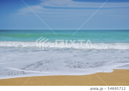 Beach sand and blue sea in blue sky 54695712