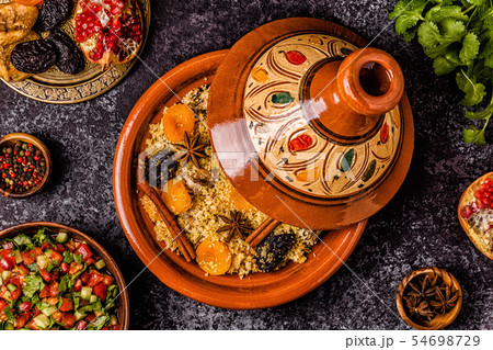 Traditional moroccan tajine of chicken with dried 54698729