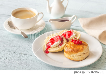 Classic scones with cream and berry jam Classic scones with cream and berry jam 54698759