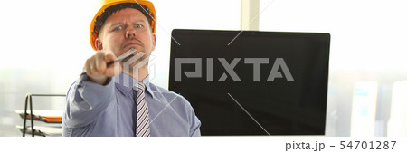 Serious Architect Working on Construction Outline 54701287