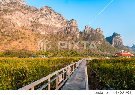 Wooden Bridge in the lake and mountain lanscape on Wooden Bridge in the lake and mountain lanscape on 54702933