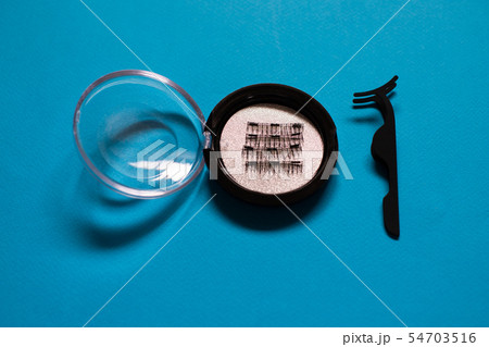 Artificial Magnetic False Eyelashes Tool on blue Artificial Magnetic False Eyelashes Tool on blue 54703516