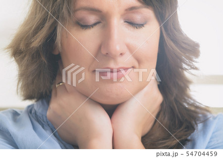 Woman practicing energy medicine Woman practicing energy medicine 54704459