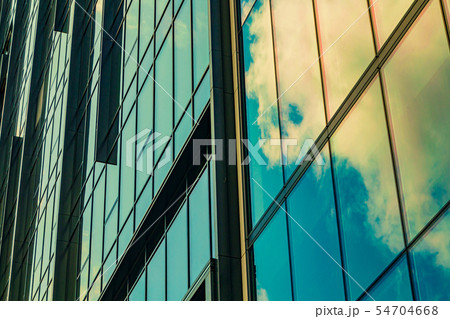 Sky with clouds reflected in windows of modern Sky with clouds reflected in windows of modern 54704668
