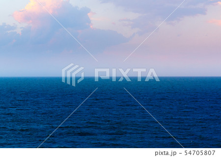 Coastline of the sea in the rays of the setting Coastline of the sea in the rays of the setting 54705807
