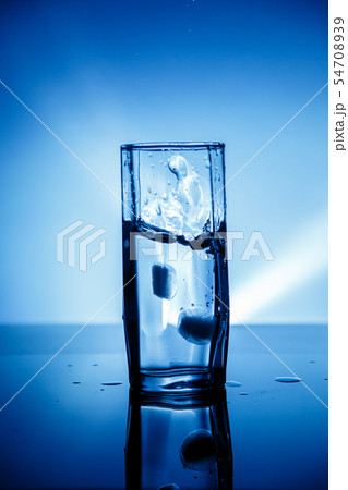 transparent glass in which water is poured with 54708939