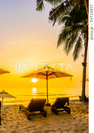 Umbrella and chair on the beautiful beach and sea at sunrise time for travel and vacation 54714857