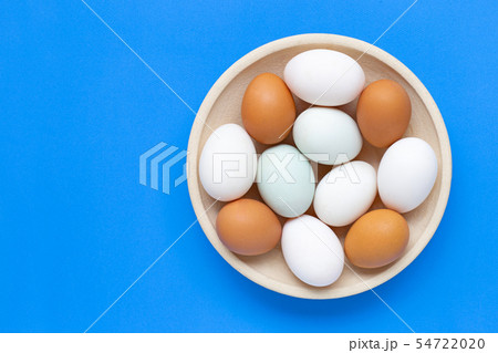 Eggs on blue background. 54722020