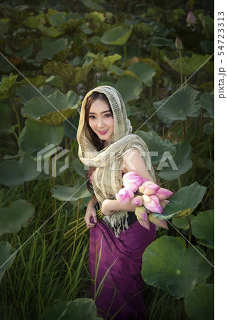 woman harvesting water lilies woman harvesting water lilies 54723313
