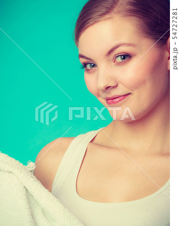 Attractive woman holding big white towel Attractive woman holding big white towel 54727281
