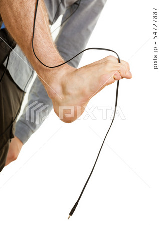 Man foot having cable between toes 54727887