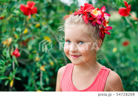 Cute smiling little girl portrait on summer day in the street 54728209