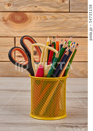 Colored pencils in basket. Colored pencils in basket. 54735156