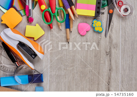 Colorful school supplies on wooden background. 54735160