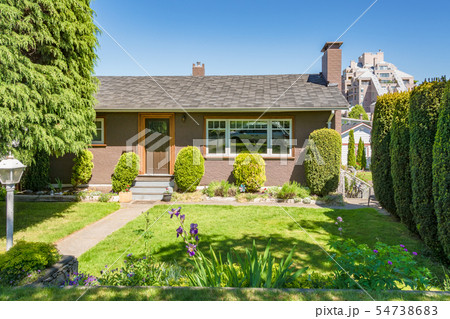 Front yard of residential house decorated with 54738683