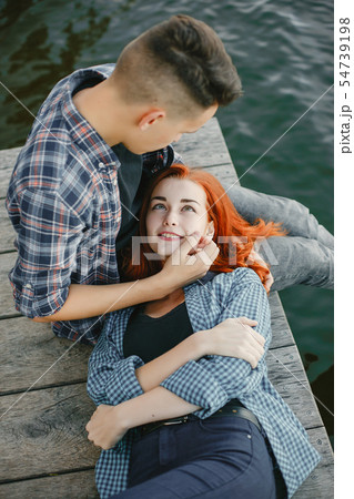 Beautiful couple spend time near a water 54739198