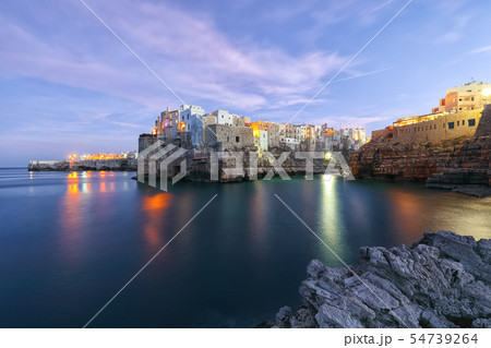 Sunset at Cala Paura gulf in Polignano a Mare 54739264