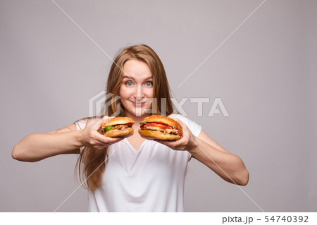 Advertisment of two burgers with juicy chicken and Advertisment of two burgers with juicy chicken and 54740392