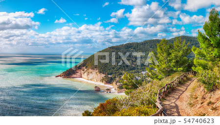 Picturesque islets Faraglioni di Puglia in summer Picturesque islets Faraglioni di Puglia in summer 54740623