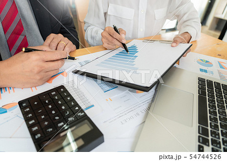 businessmen discussing project at meeting pointing businessmen discussing project at meeting pointing 54744526