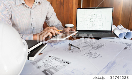 Confident engineer team working with Blue Print 54744528