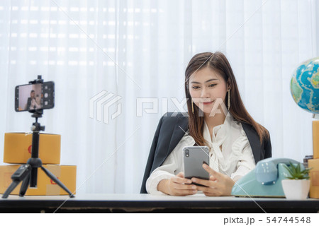 Young Asian woman as vlogger or blogger attending 54744548