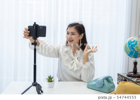 Young Asian woman as vlogger or blogger attending 54744555