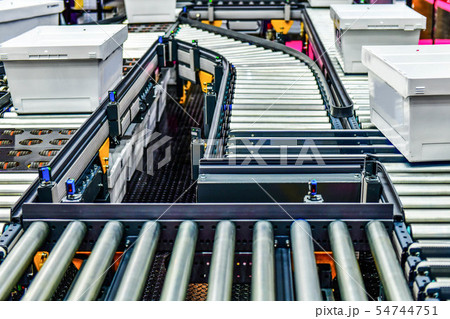 White plastic box on conveyor belt at industrail White plastic box on conveyor belt at industrail 54744751