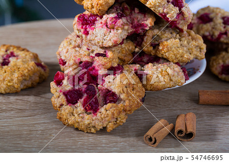 Closeup of oatmeal cookies on plate on wooden background Closeup of oatmeal cookies on plate on wooden background 54746695