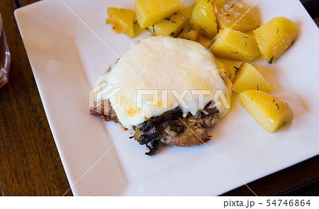 Appetizing fried pork with mushrooms in Provencal sauce Appetizing fried pork with mushrooms in Provencal sauce 54746864