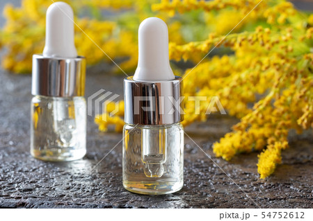 Bottles of goldenrod essential oil 54752612