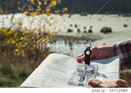 hiking tourism man compass map nature landscape hiking tourism man compass map nature landscape 54752680