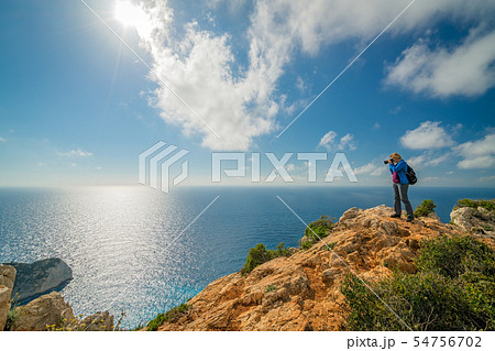 Tourist photographing Navagio Beach and Shipwreck Tourist photographing Navagio Beach and Shipwreck 54756702
