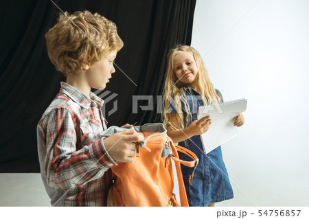Boy and girl preparing for school after a long summer break. Back to school. 54756857