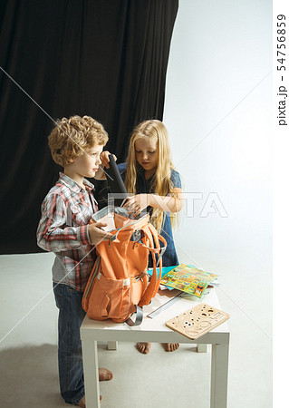 Boy and girl preparing for school after a long summer break. Back to school. 54756859