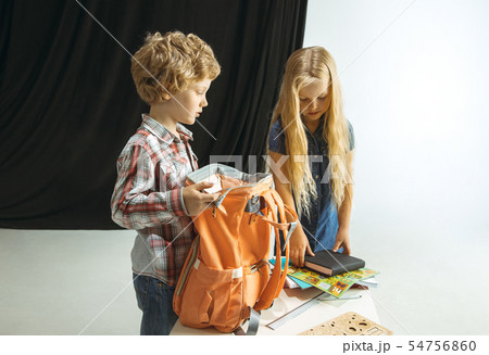 Boy and girl preparing for school after a long summer break. Back to school. 54756860