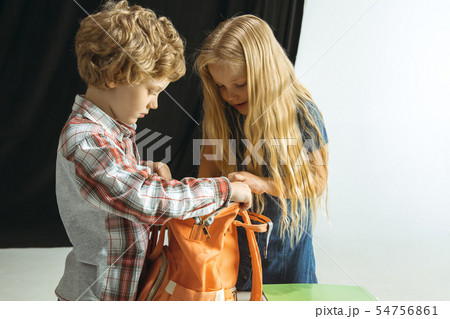 Boy and girl preparing for school after a long summer break. Back to school. 54756861