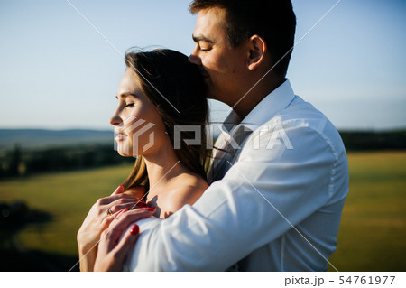 Photo of young loving couple cuddling. 54761977
